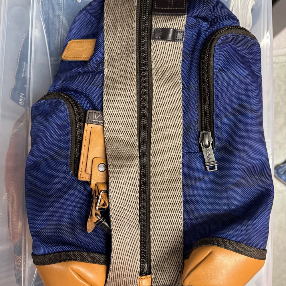 Tumi Blue and Tan Backpack with Structured Design